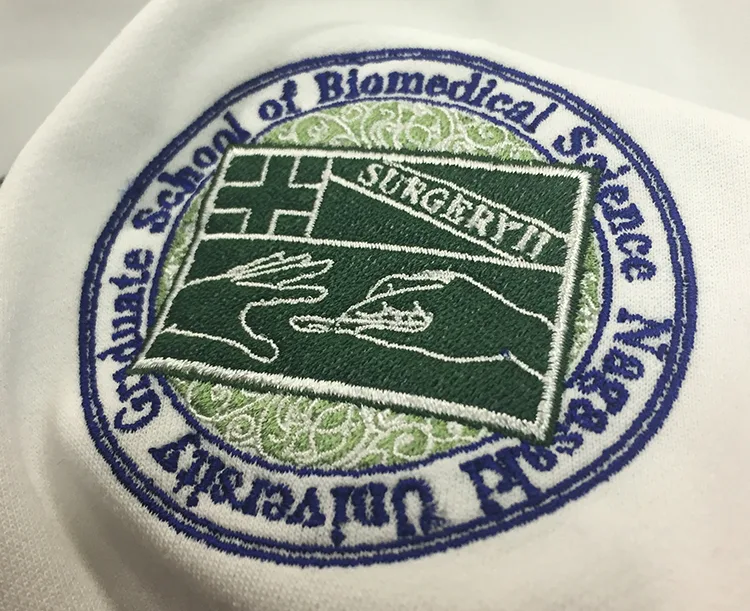 Nagasaki University Graduate School of Biomedical Science の刺繍（白衣・スクラブへの着用イメージ）