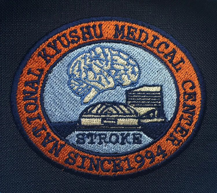 NATIONAL KYUSHU MEDICAL CENTER のエンブレム・オリジナルロゴ。医療スクラブ・白衣に施した刺繍の実績