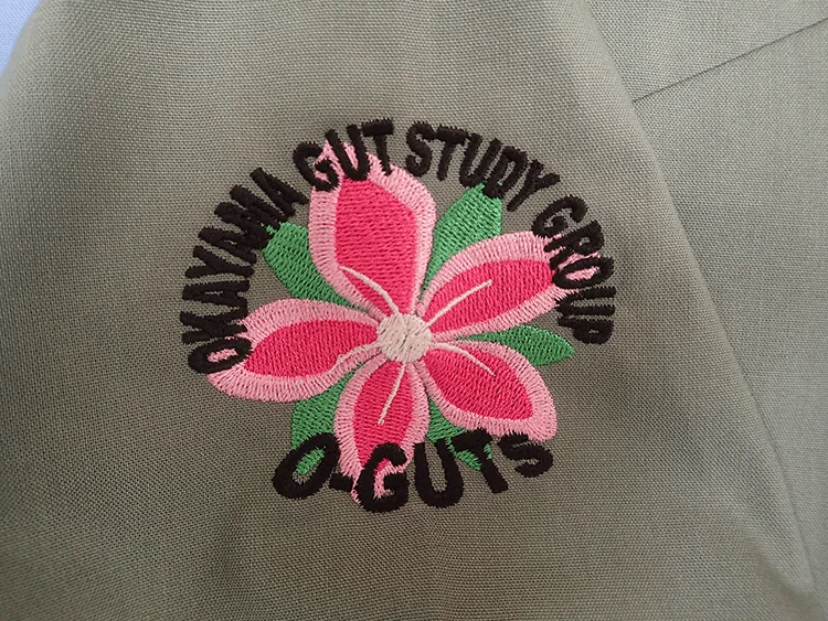 OKAYAMA GUT STUDY GROUP の刺繍（ディテール）
