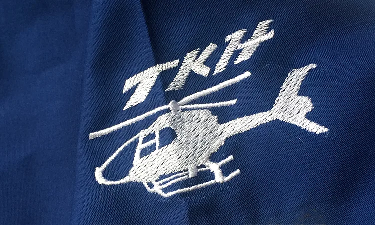 TKH 2014 のオリジナルロゴ・ドクターヘリ。医療スクラブ・白衣に施した刺繍の実績