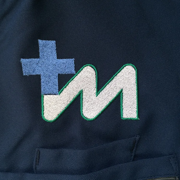 Tsukuba Medical Center Hospital のオリジナルロゴ・十字架。医療スクラブ・白衣に施した刺繍の実績
